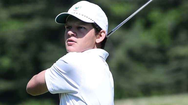 Thomas Finn of Locust Valley watches his second shot hit...