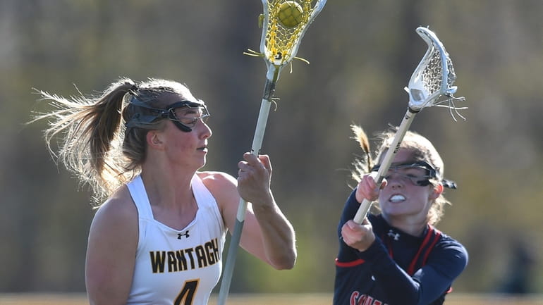 Madison Taylor of Wantagh, left, gets in position to shoot...