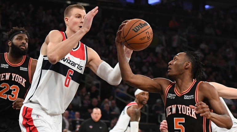 New York Knicks guard Immanuel Quickley draws a foul against...