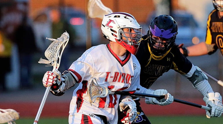 Connetquot attack Matt Oehl drives from behind the goal against...