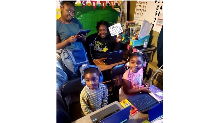 Ebony Guerrier works at home in Uniondale her children Madison,...
