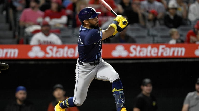 Tampa Bay Rays' Jose Caballero watches his RBI double against...