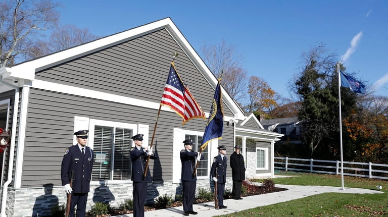 An honor guard outside the new customized home of Suffolk...