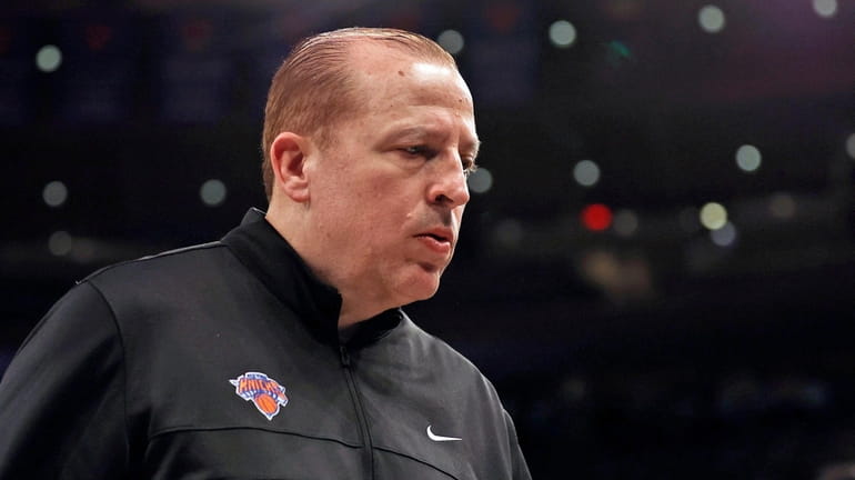Knicks coach Tom Thibodeau walks off the court after an...