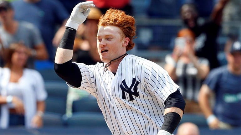 Clint Frazier of the Yankees celebrates his ninth-inning walk-off three-run...