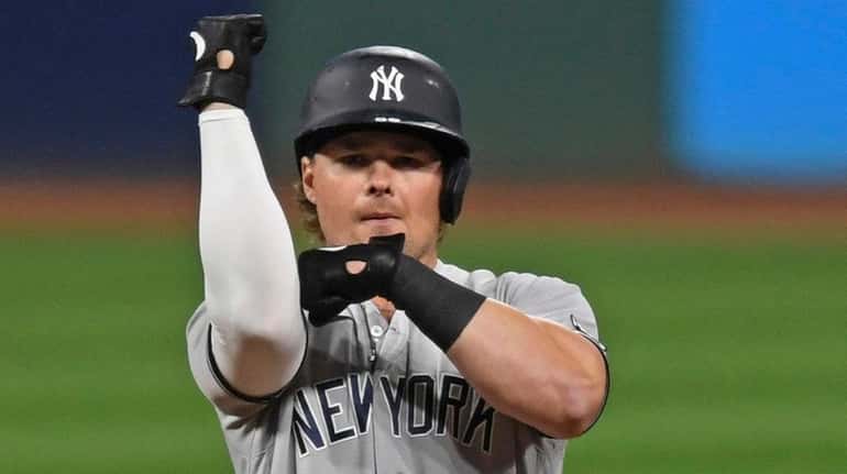 The Yankees' Luke Voit celebrates after hitting a RBI double...