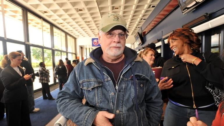 Sam Handle, 61, of Ridge, was first on line at...