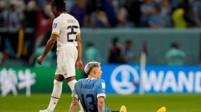 Uruguay's Guillermo Varela sits at the end of a World...