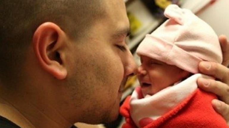 Air National Guard Staff Sgt. Louis Bonacasa with his daughter...