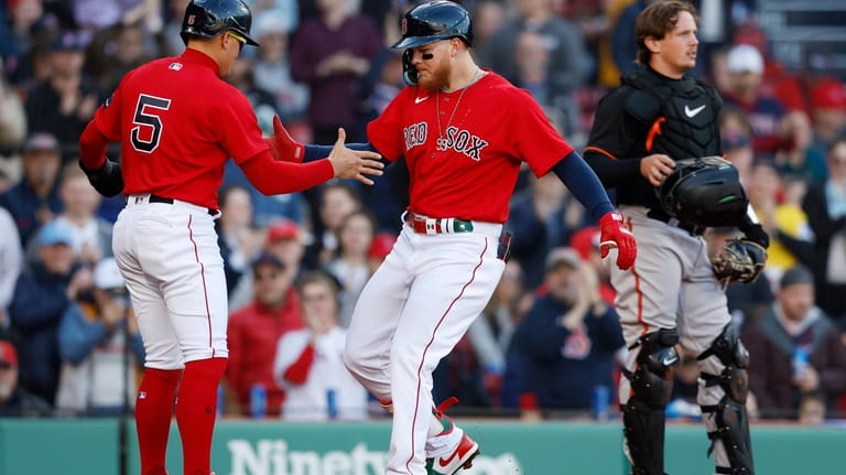 Boston Red Sox's Alex Verdugo, center, celebrates his two-run home...