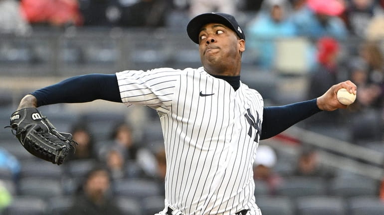 New York Yankees relief pitcher Aroldis Chapman delivers against the...