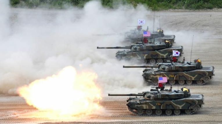 A South Korean marine K1 tank fires during a joint...