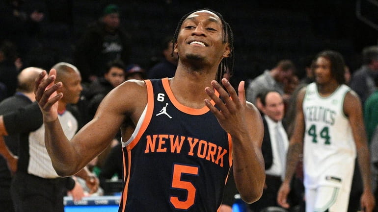 New York Knicks guard Immanuel Quickley reacts as the clock...
