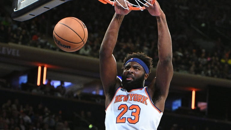 Knicks center Mitchell Robinson dunks against the Boston Celtics during...