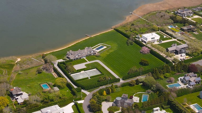 8. This 7,400-square-foot, six-bedroom home on Sagaponack Pond sold along with...