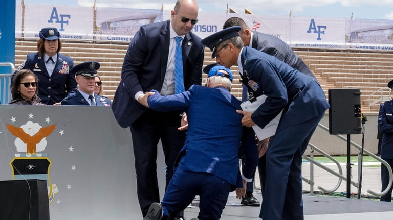 President Joe Biden falls on stage during the 2023 United...