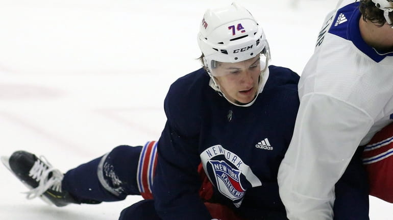 Vitali Kravtsov fights for puck during 4th day of Rangers...