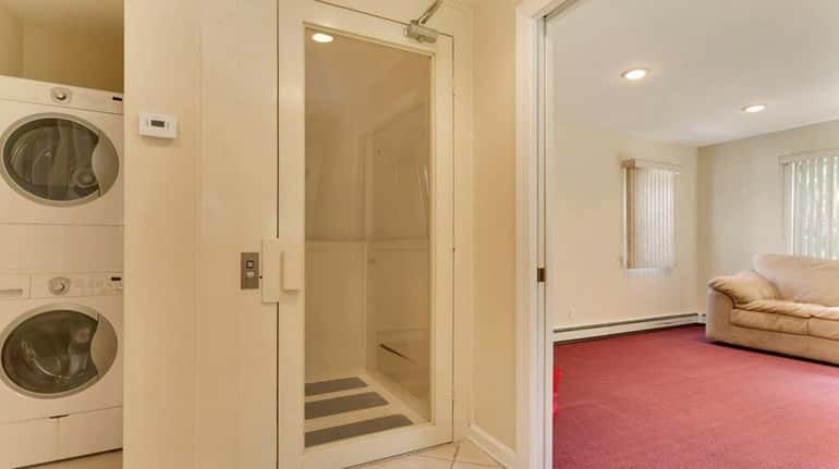 The elevator in this Dix Hills Colonial, on the market...