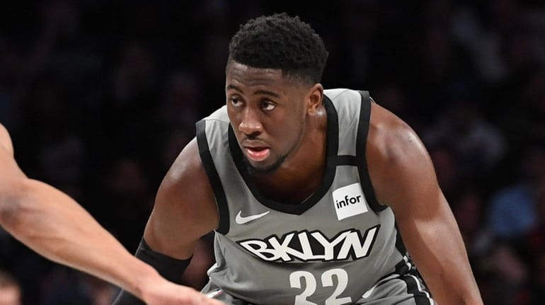 Nets guard Caris LeVert is defended during the first half...