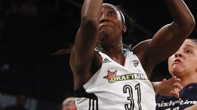 New York Liberty's Tina Charles goes to the basket against...