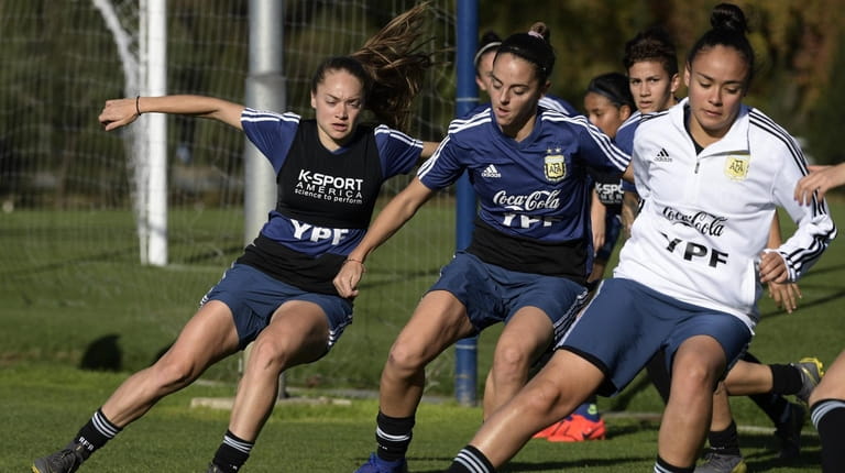 Argentina's woman footballers warm-up before a friendly football match against...
