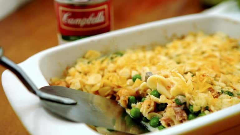 Tuna noodle casserole, from a 1950s recipe, is topped with...