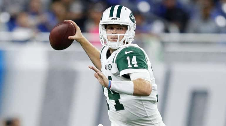 Sam Darnold of the Jets drops back for a pass in...