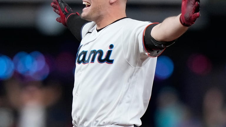 Miami Marlins' Nick Fortes reacts after hitting in the game-winning...