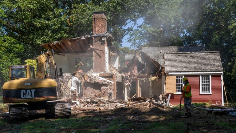 The Richardson home in Plandome Manor is demolished on Thursday.