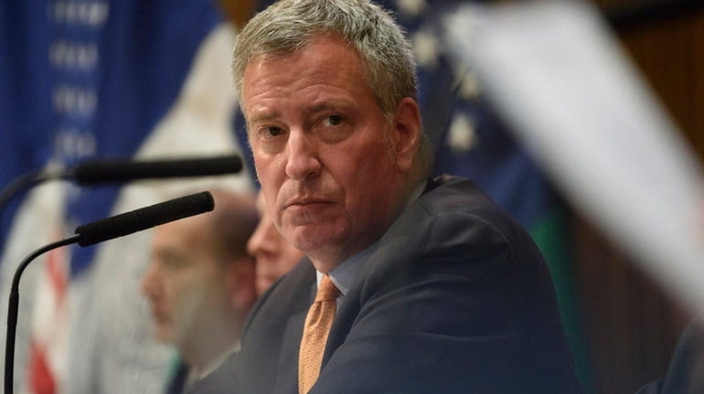Mayor Bill de Blasio attends a news conference at police...