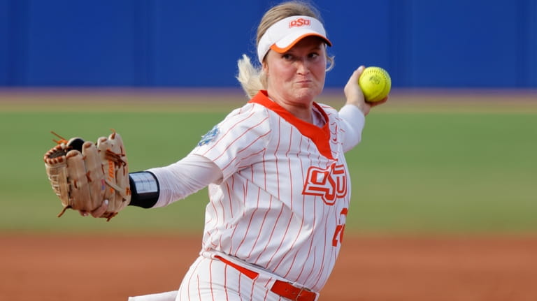 Oklahoma State's Kelly Maxwell pitches against Tennessee during the first...