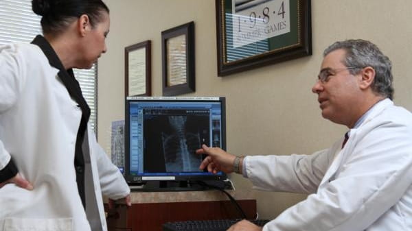 Orthopedic surgeon Dr. Dowling and his physician assistant Colleen Kelly...