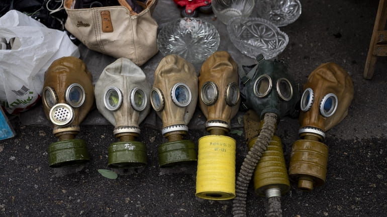 Soviet-era gas masks are for sale at a flea market...
