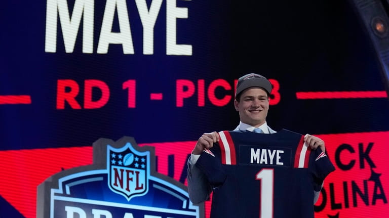 North Carolina quarterback Drake Maye poses after being chosen by...