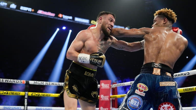 Devin Haney, right, fights Vasiliy Lomachenko in an undisputed lightweight...