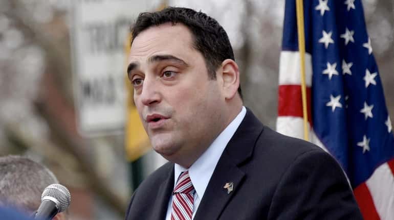 Huntington Town supervisor Chad Lupinacci addresses local officials, local veterans...