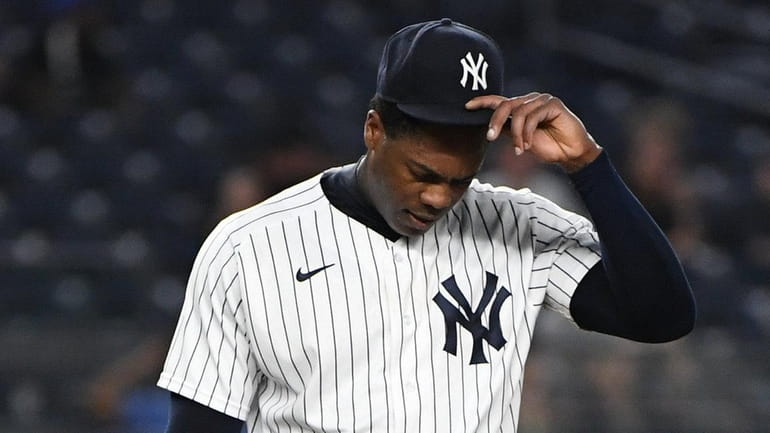 Yankees relief pitcher Aroldis Chapman reacts on the mound against...