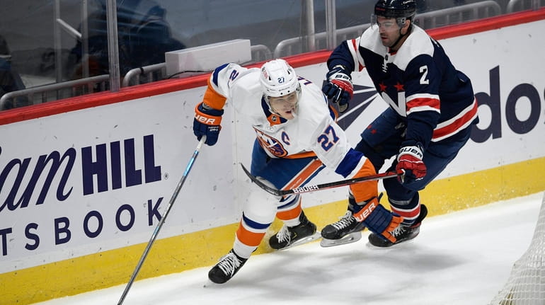 New York Islanders left wing Anders Lee (27) skates with...
