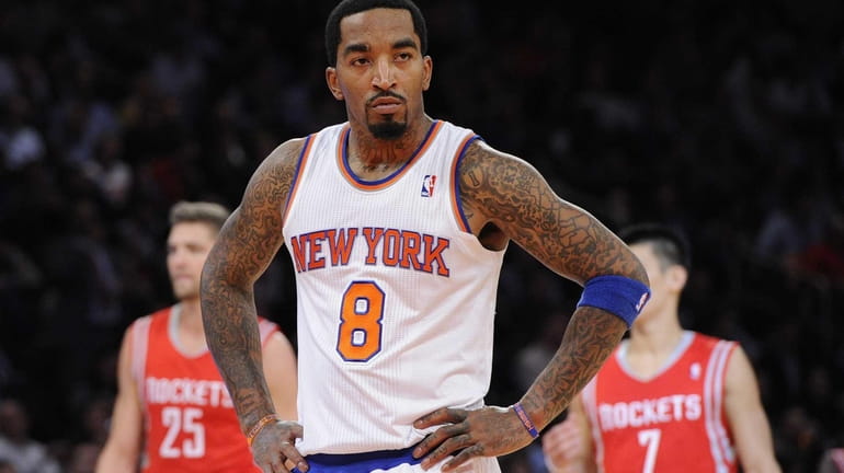 J.R. Smith looks on during a game against the Houston...