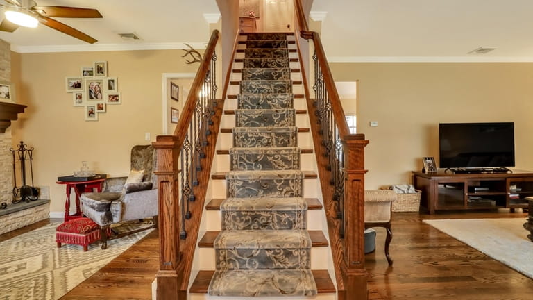 The renovation included the stair railings and fireplace.
