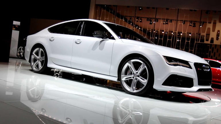 An Audi A7 sedan sits on display at the company's...