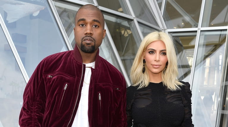 Kanye West and Kim Kardashian at Paris Fashion Week in...