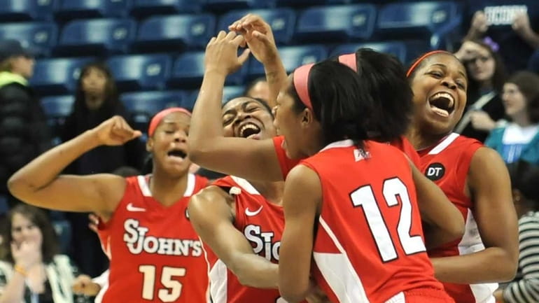 St. John's players celebrate at the end of the second...