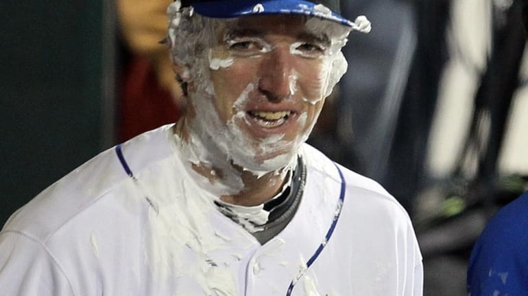 Mets rookie Ike Davis after receiving a pie in the...