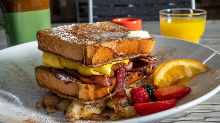 French toast stacked with bacon and eggs at Park Avenue Grill...