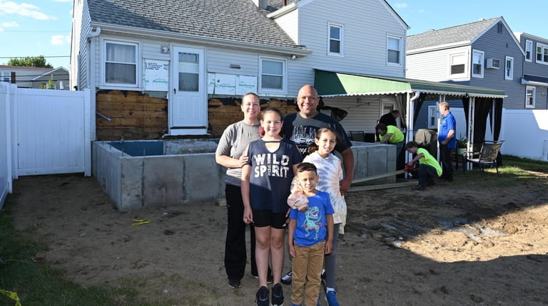 The Beauford family outside their Freeport home. The family outgrew their three-bedroom...