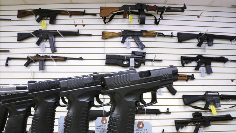 Semi-automatic guns are displayed for sale at Capitol City Arms...