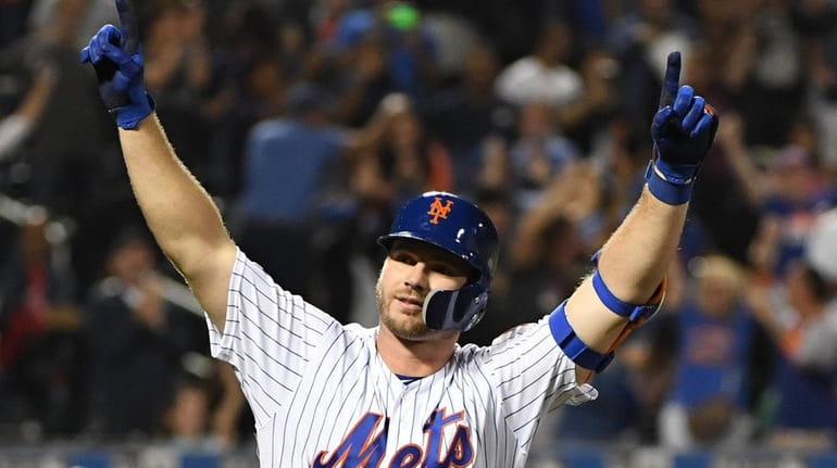 Mets' Pete Alonso reacts after he hits his 53rd home...