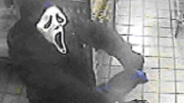 Police say a suspect wearing a 'Scream' mask entered the...