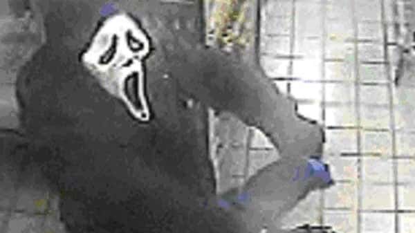 Police say a suspect wearing a 'Scream' mask entered the...